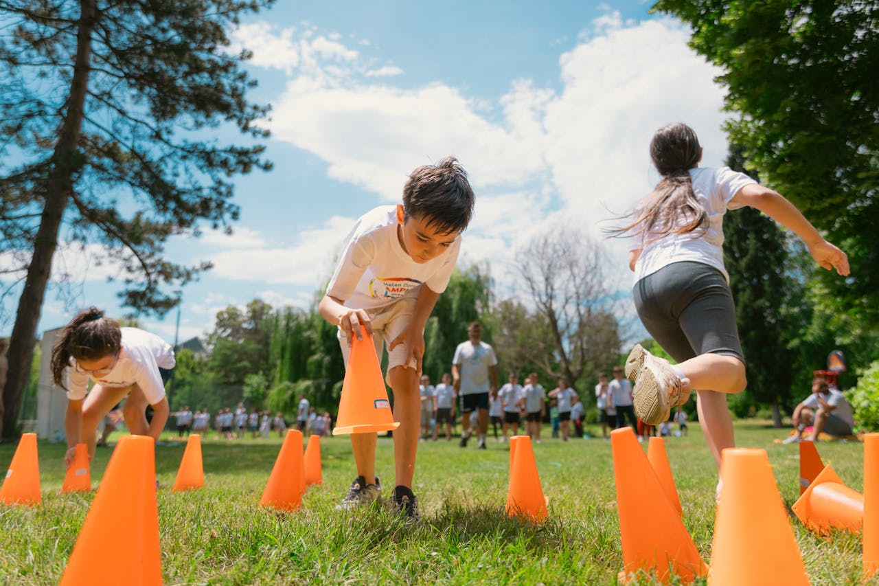 Running obstacle race at outdoor camp