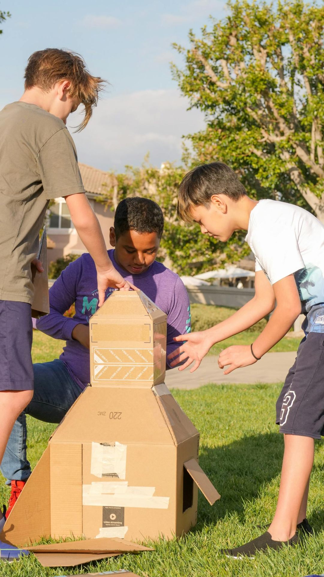 Team building with cardboard project outdoors